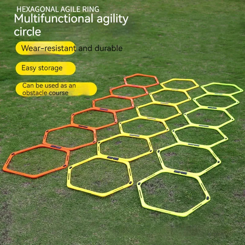 Set of six foldable yellow, green, and orange plastic hexagon football agility training rings laid out on grass.