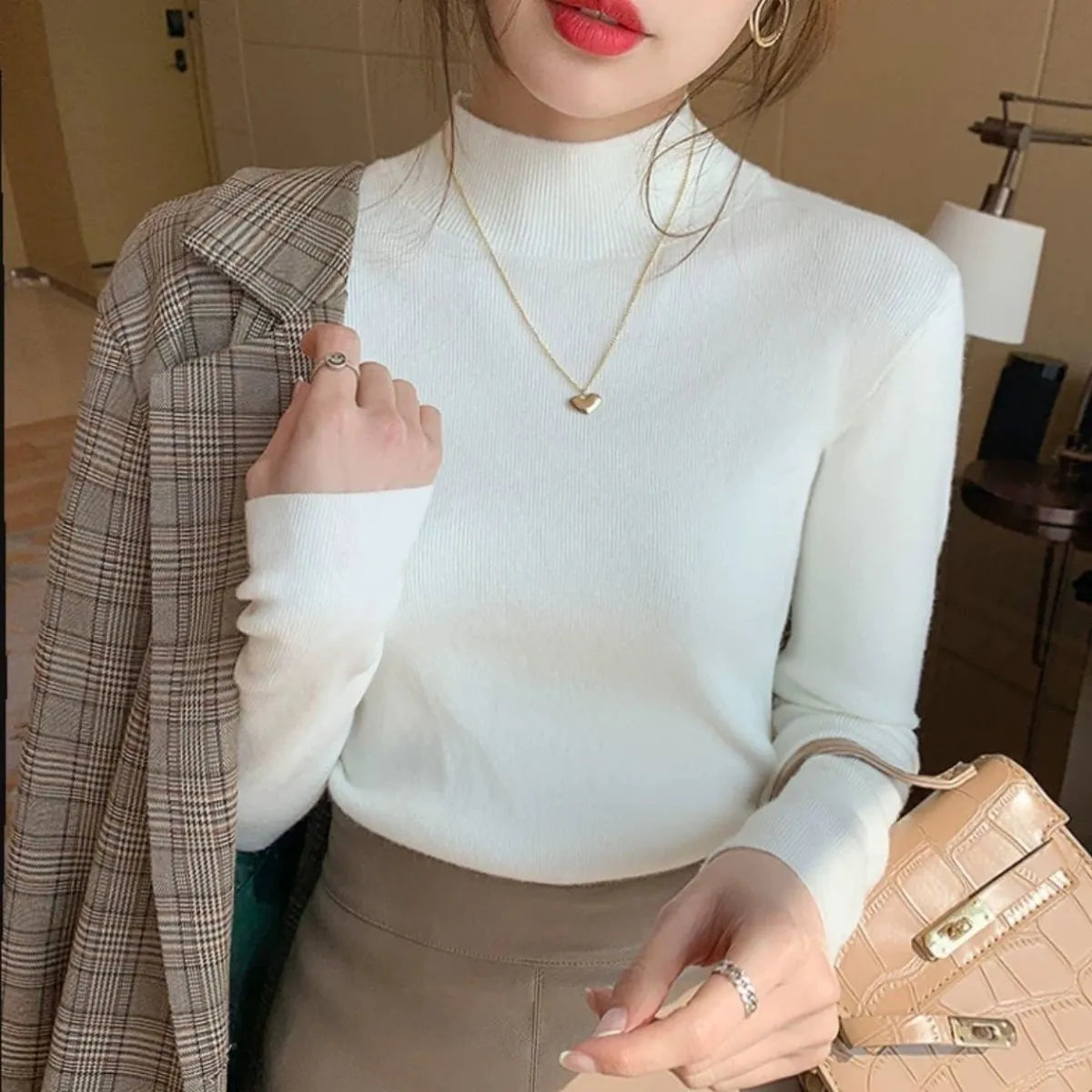 Women's slim fit viscose knitted long sleeve shirt in various colours including apricot, black, and gentle blue.