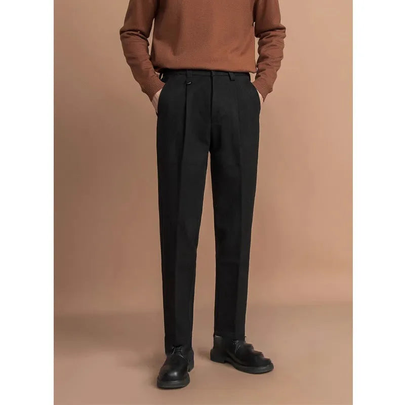 Men's straight leg casual pants in black with a draped fit, shown on a hanger.