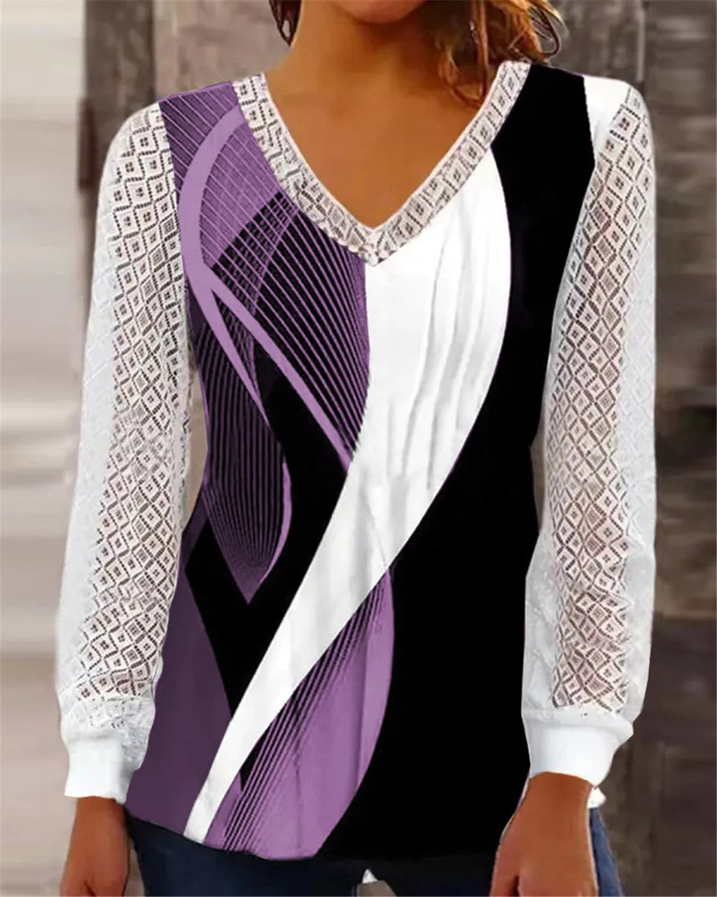 Purple loose V-neck women's top with hollow-out lace pattern and long sleeves.