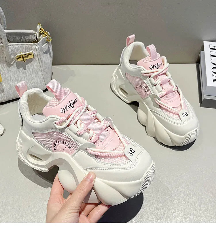 Women's pink casual sneakers with cross strap design and thick mid-heel sole