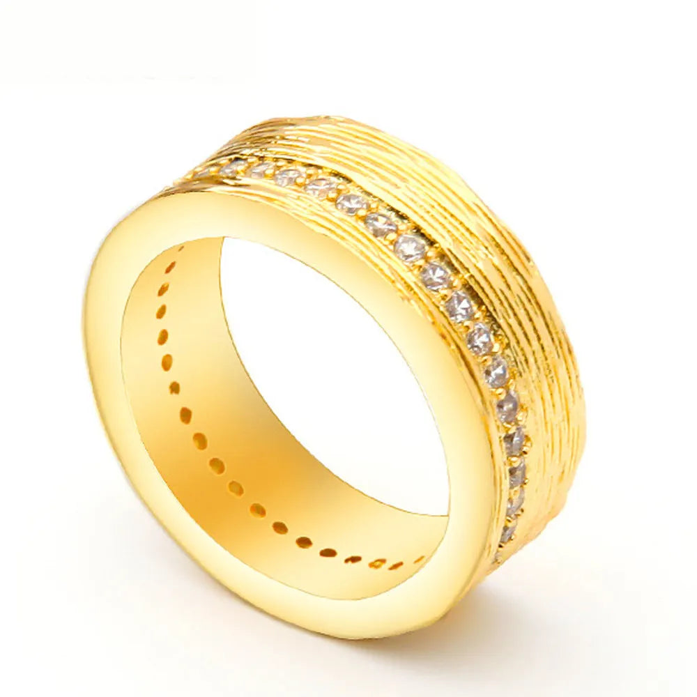 Geometric gold-coloured zircon ring for women showing detailed design and electroplated finish