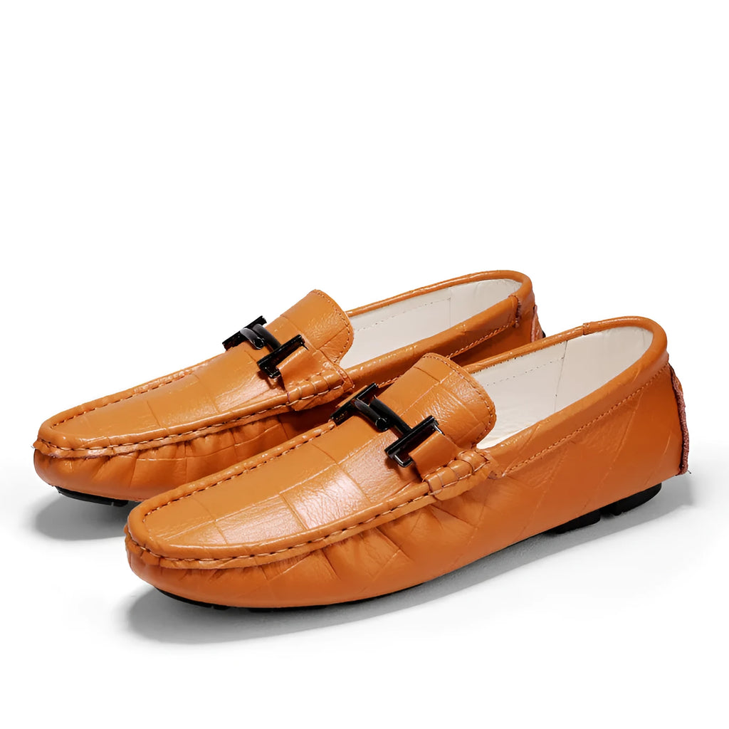 Men's black casual leather shoes with a silver buckle on a white background.