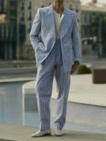 Men's blue and white striped polyester suit set with regular fit blazer and trousers on a hanger.