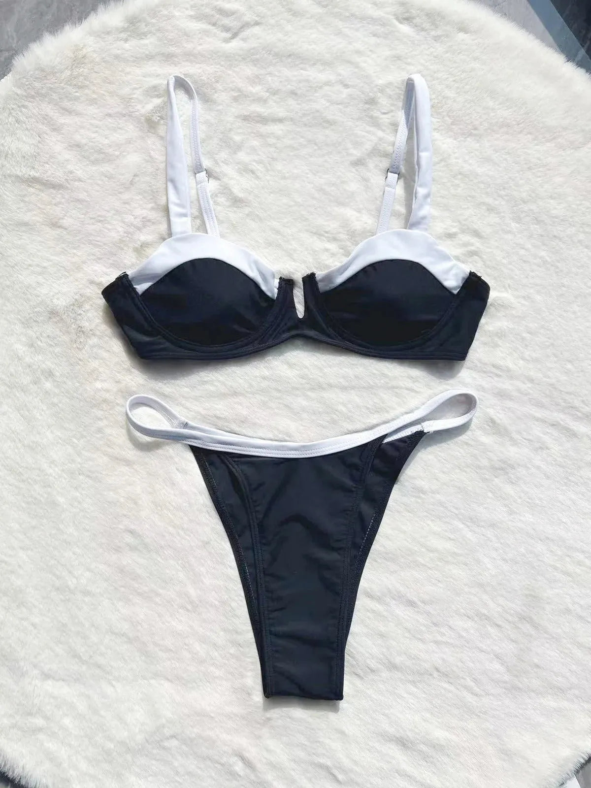 Black low waist bikini swimsuit with stitching split detail and briefs style cut