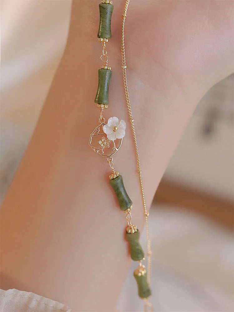 Handmade natural olivine stone bracelet with double layer twin bells of Ireland design.