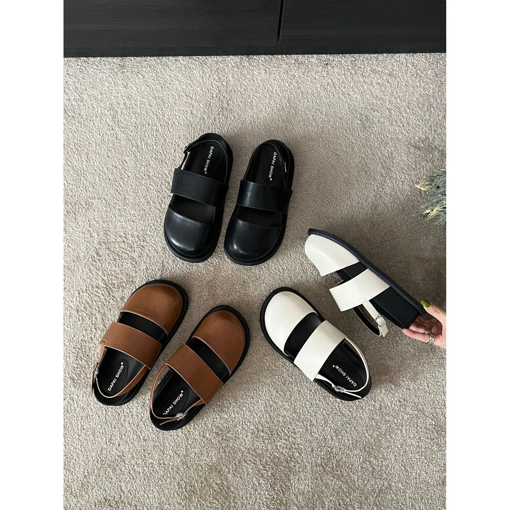 Retro apricot women's sandals with a raised sole, closed toe, and an adjustable ankle strap buckle.