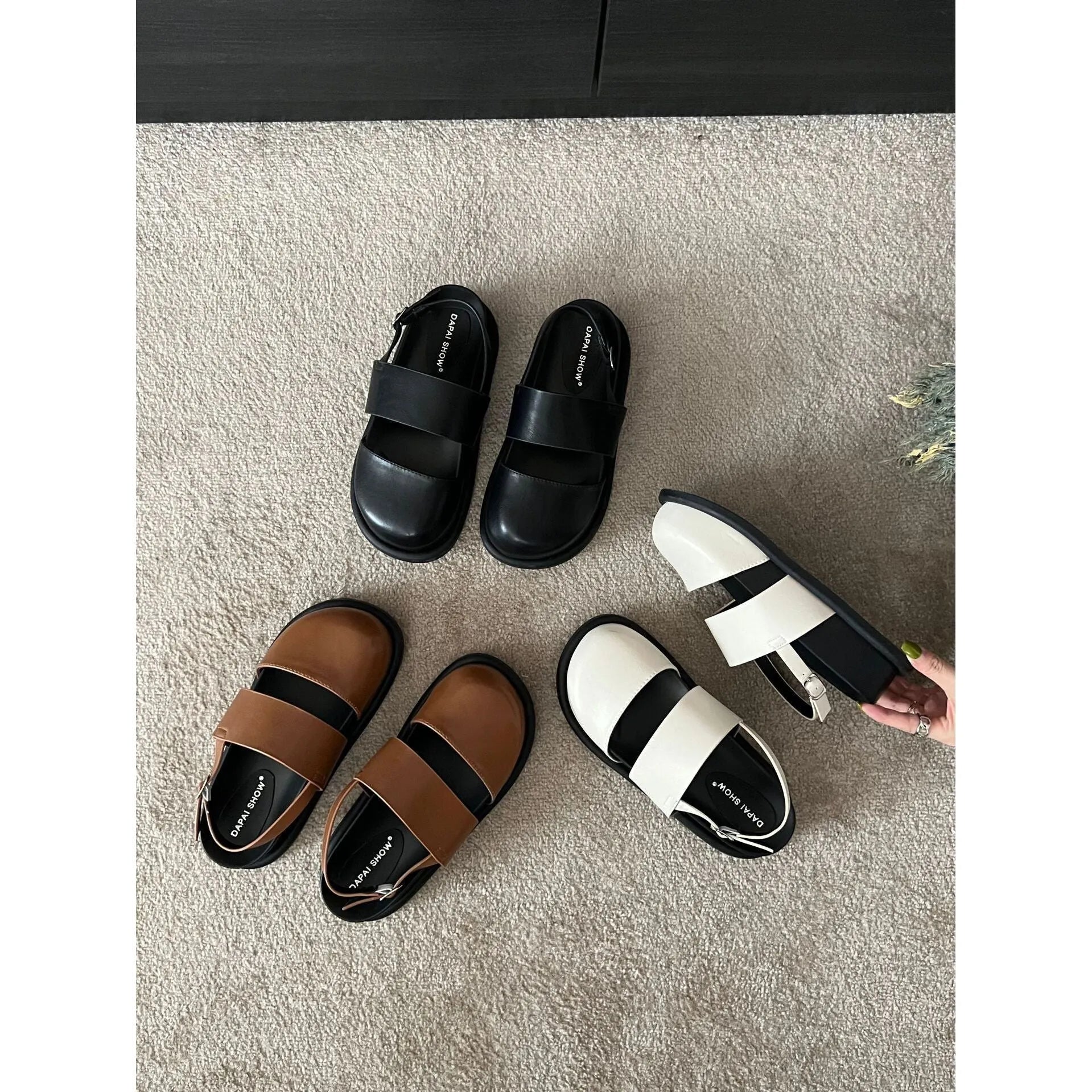 Retro apricot women's sandals with a raised sole, closed toe, and an adjustable ankle strap buckle.
