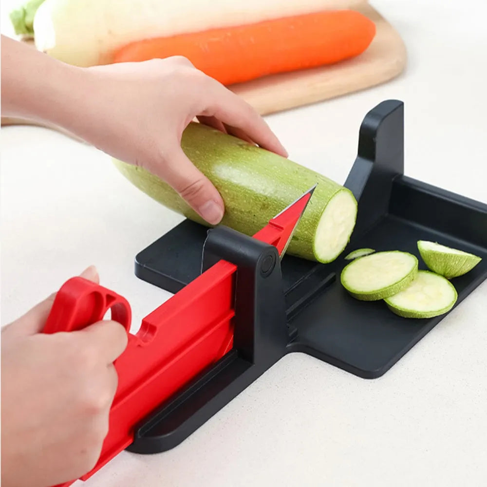 Green and red plastic vegetable cutter with stainless steel blades for slicing carrots and potatoes.