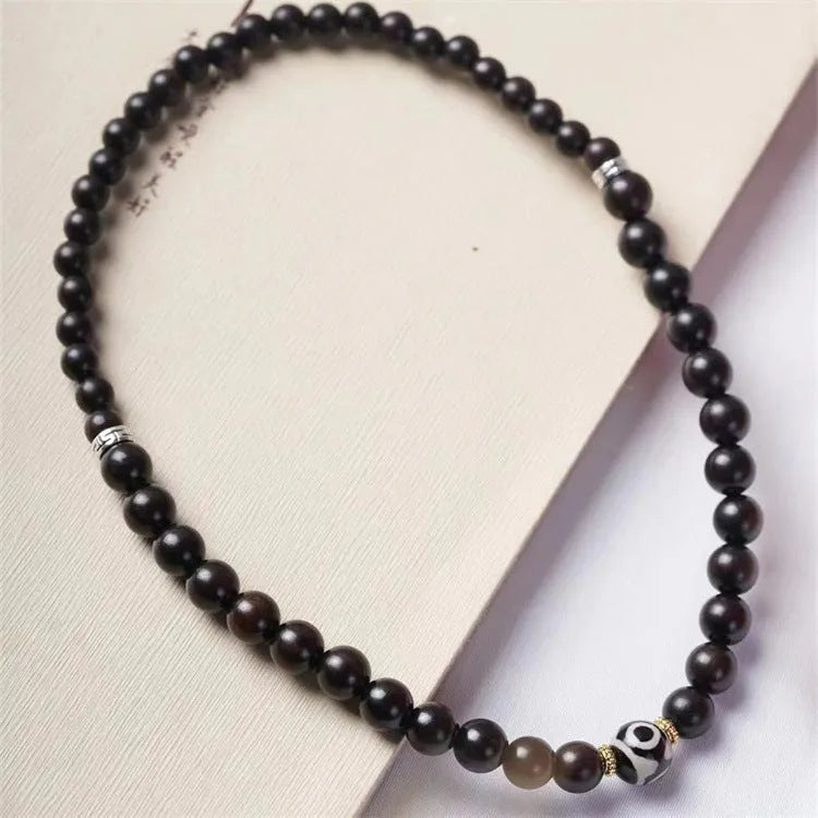 Ebony wood bracelet with 8mm beads and Tibetan two-circle pattern