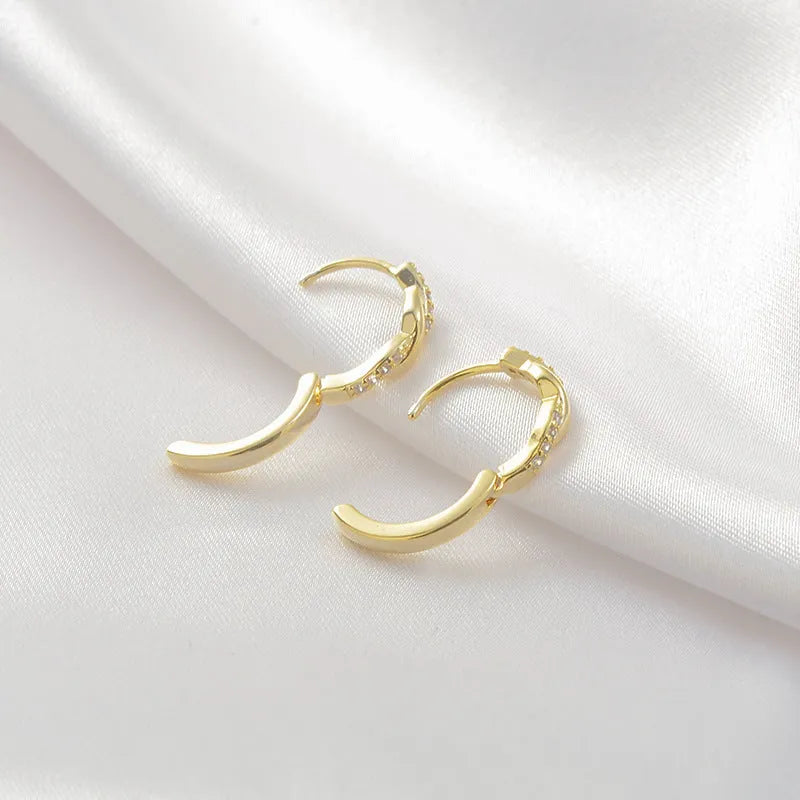Geometric interwoven hemp rope earrings in gold or silver colour with copper construction