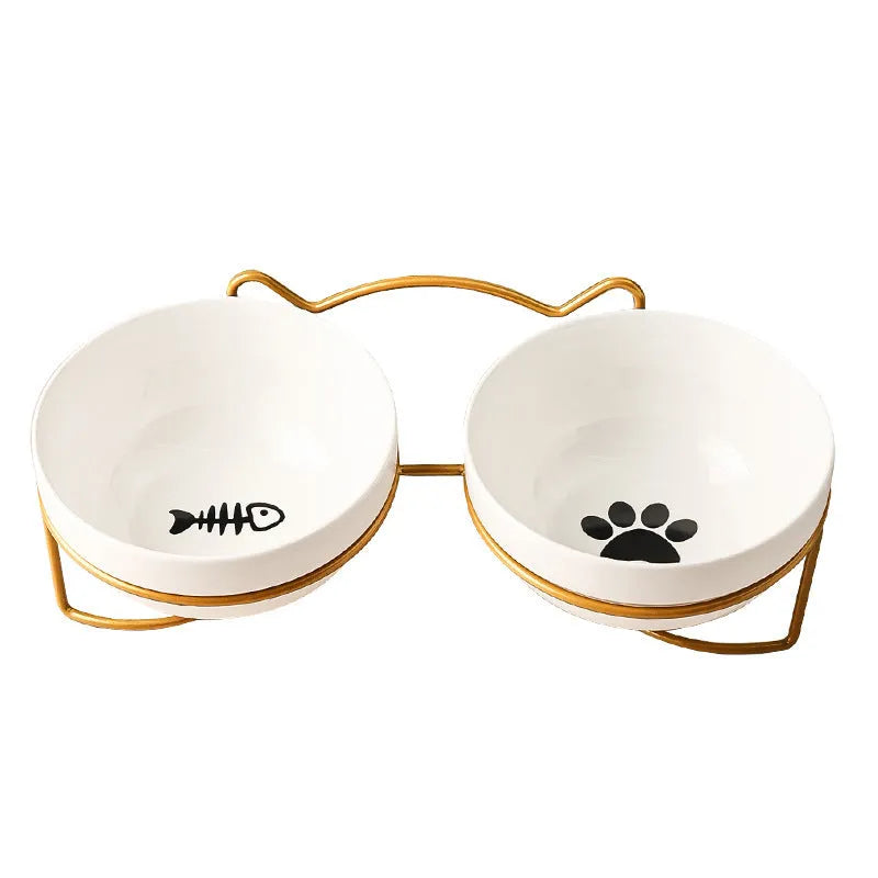 White ceramic cat bowl with decorative iron frame in cat footprints pattern