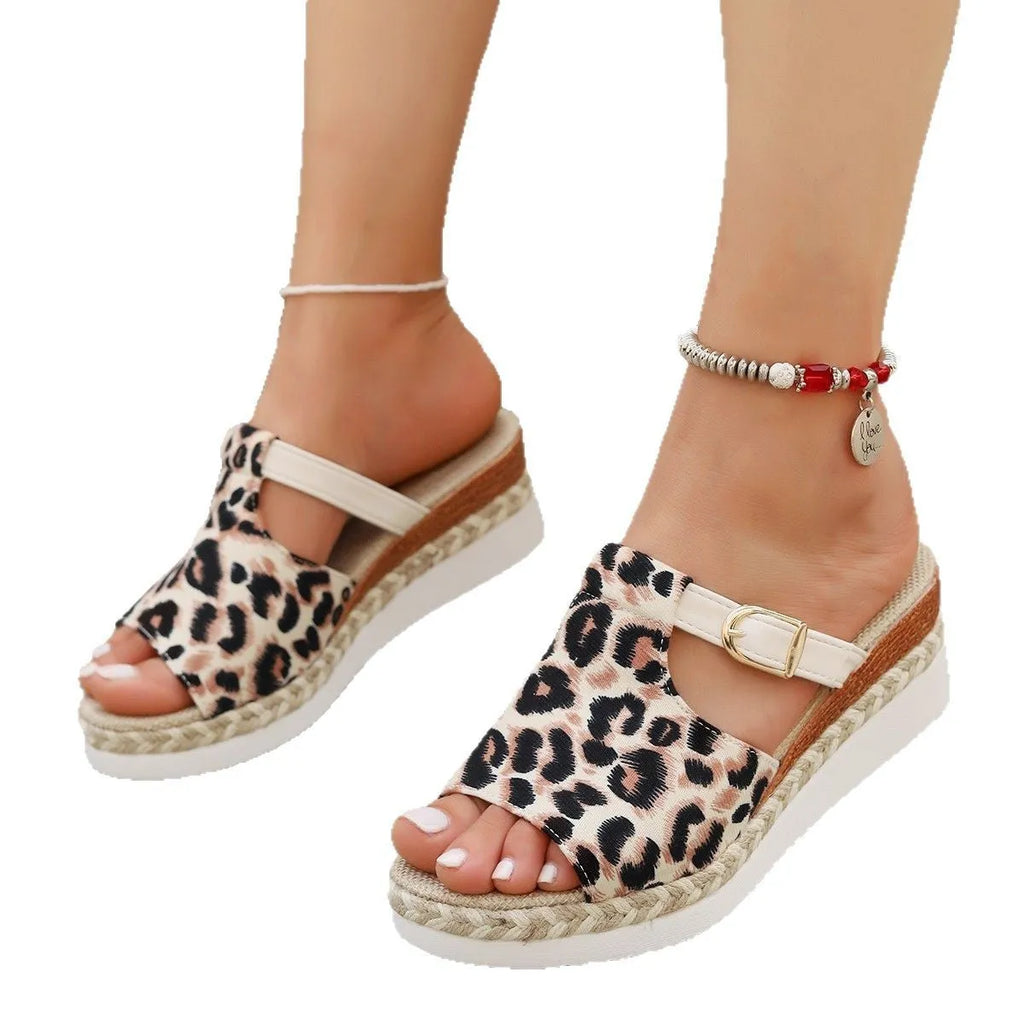 Leopard print women's wedge platform sandals with a fish mouth toe and rubber sole.