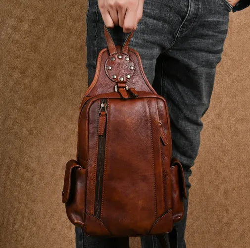 Men's genuine leather chest crossbody messenger bag, 11 inch, in light brown or black with polyester cotton lining.