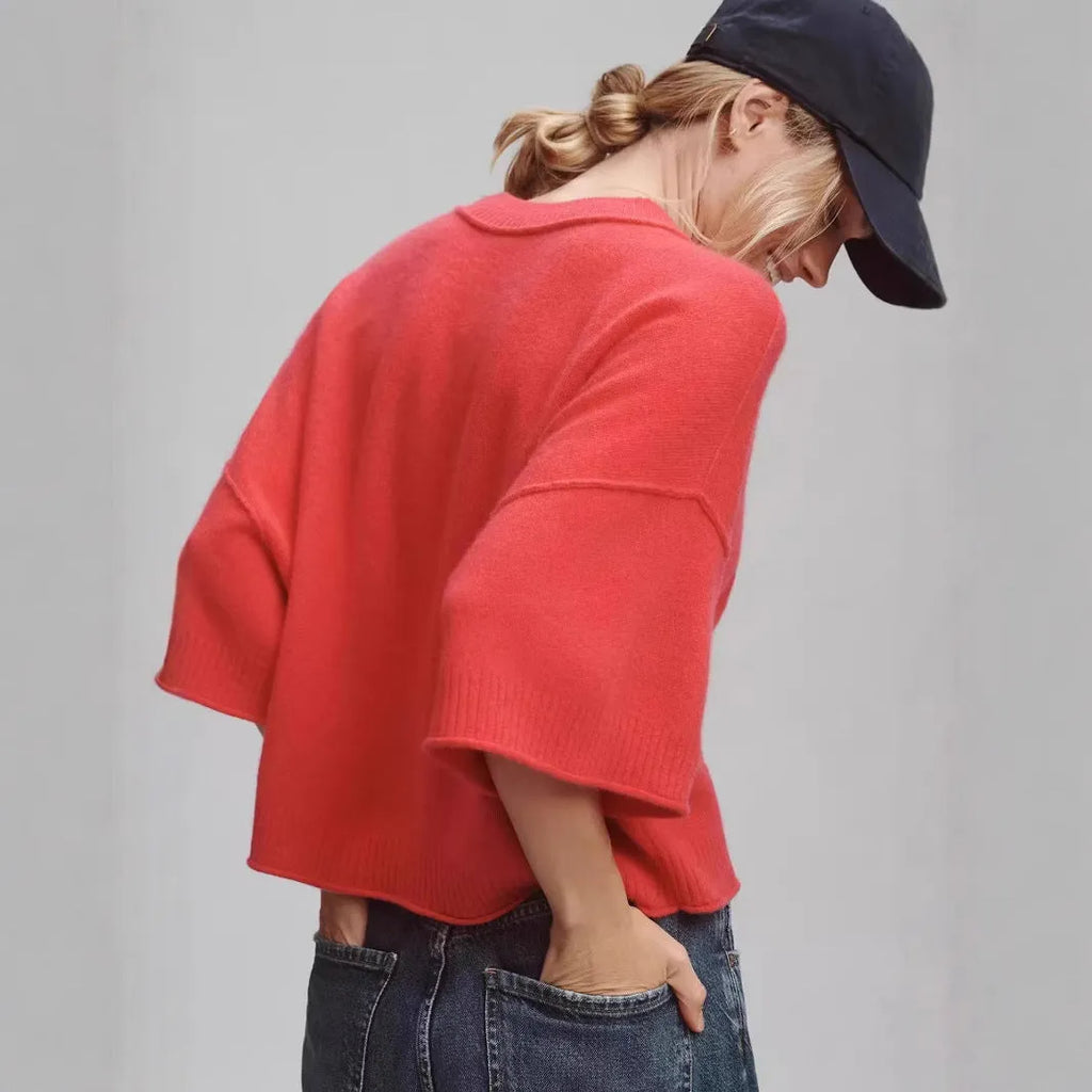 Red short sleeve viscose t-shirt with a cropped, exposed navel hem on a mannequin.