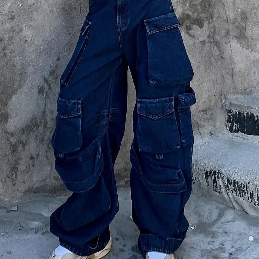 Dark blue distressed women's jeans with a high waist, wide legs, and multiple workwear-style pockets.