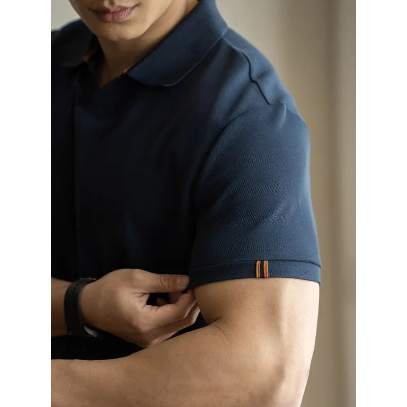 Man's American-style blue cotton blend short-sleeved polo shirt on a hanger.