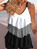 Women's backless bikini swimsuit with spaghetti straps, ruffle detail, and split briefs in a floral print.