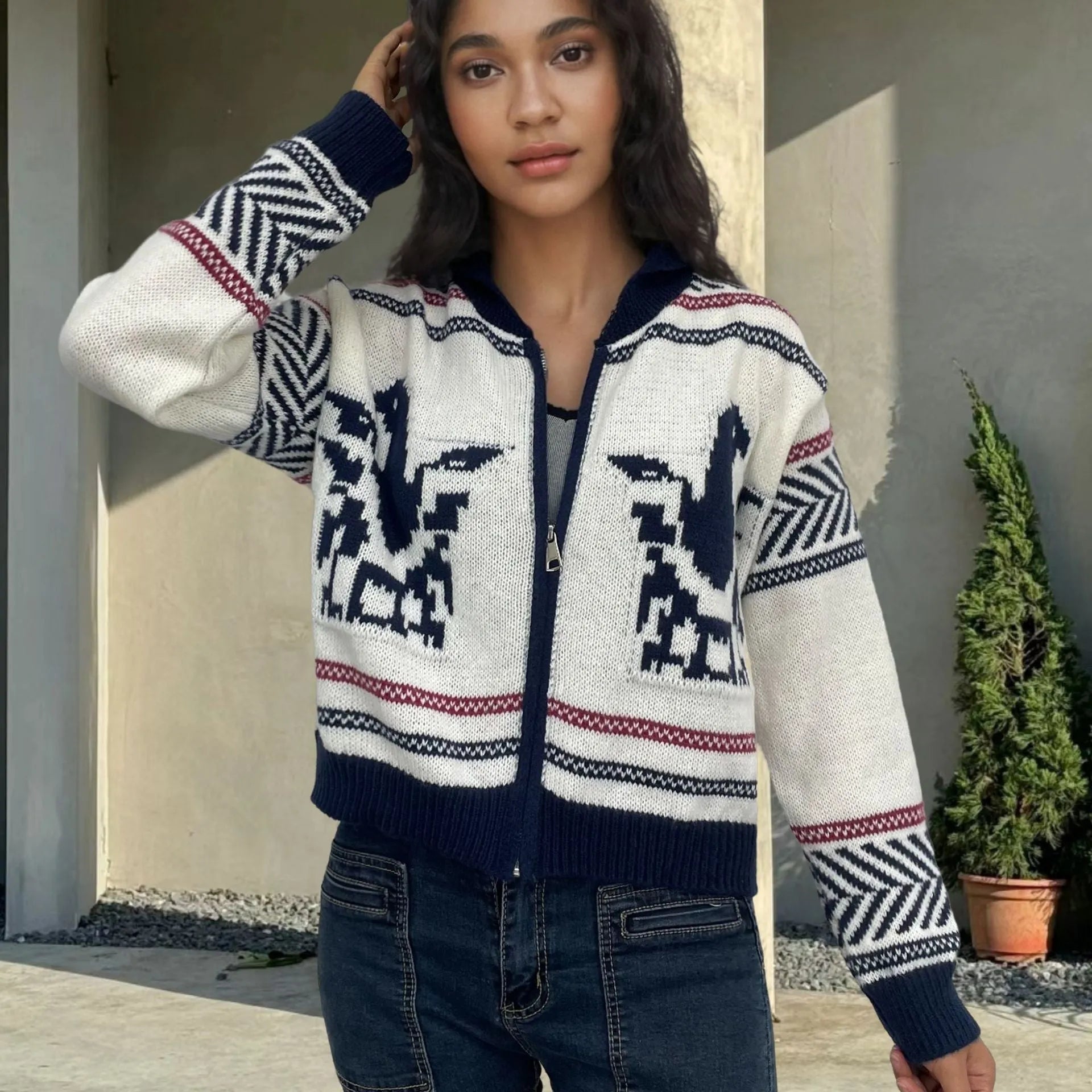 White women's zip-up cardigan with a jacquard contrast colour stripe pattern and a lapel collar.