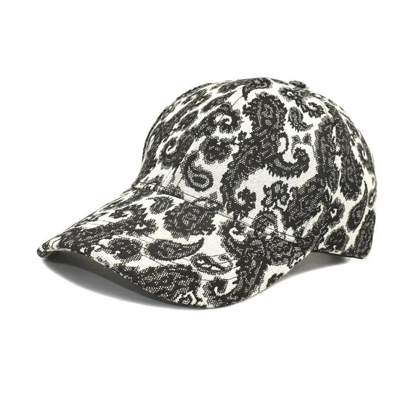 Polyester baseball cap with paisley pattern print in blue, black or wine red colours showing dome crown design