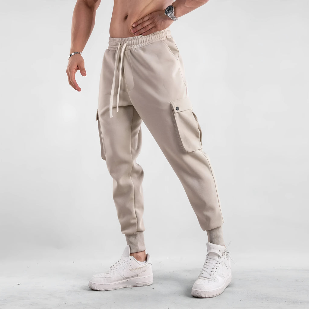 Men's loose cotton sports trousers with ankle-tied cuffs and multiple pockets in various colour options