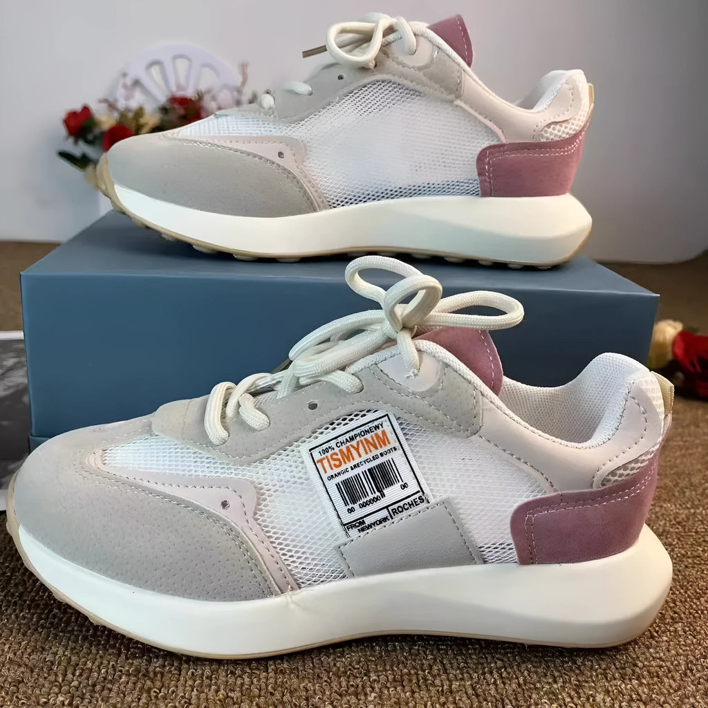 Women's grey and pink retro sneakers with low top design and rubber sole