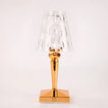 Rose gold portable touch-control projection night light on a tabletop
