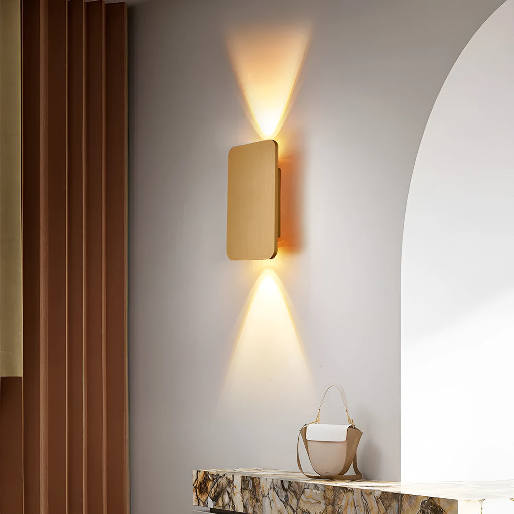 Minimalist modern LED wall lamp in black finish mounted on a wall.