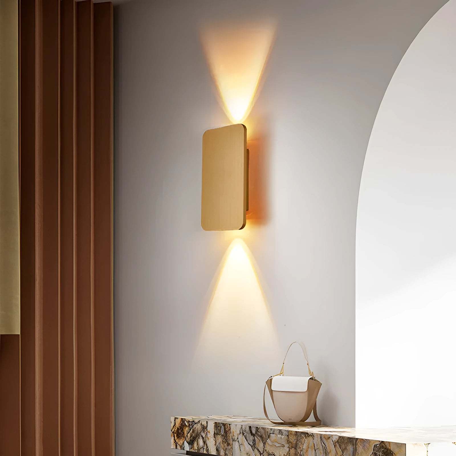 Minimalist modern LED wall lamp in black finish mounted on a wall.