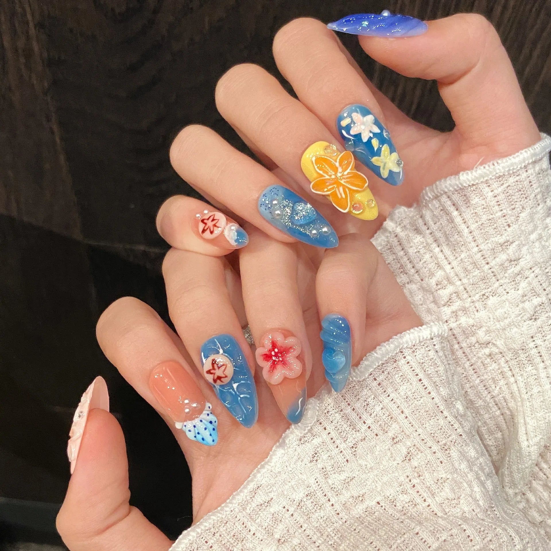 Three-dimensional carved jellyfish design wearable armour in almond nail colour with rose and tulip patterns