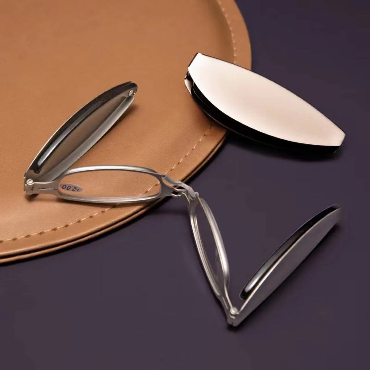Black folding presbyopic reading glasses with retro ring temples, shown in open and closed positions.