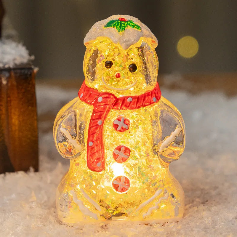 Set of four glowing plastic Christmas ornaments: gingerbread men and snowmen with red, white, and transparent scarves.
