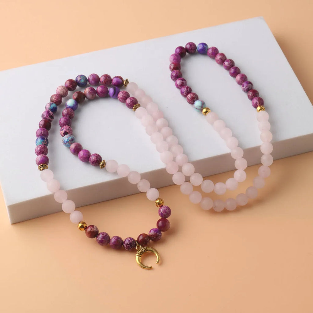 Pink crystal Emperor Stone beads pendant necklace on model, showing round beads and adjustable chain