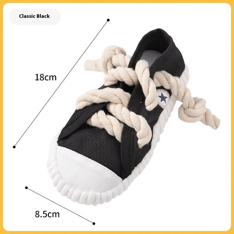 Slipper-shaped plastic dog chew toy with squeaker in three colour options