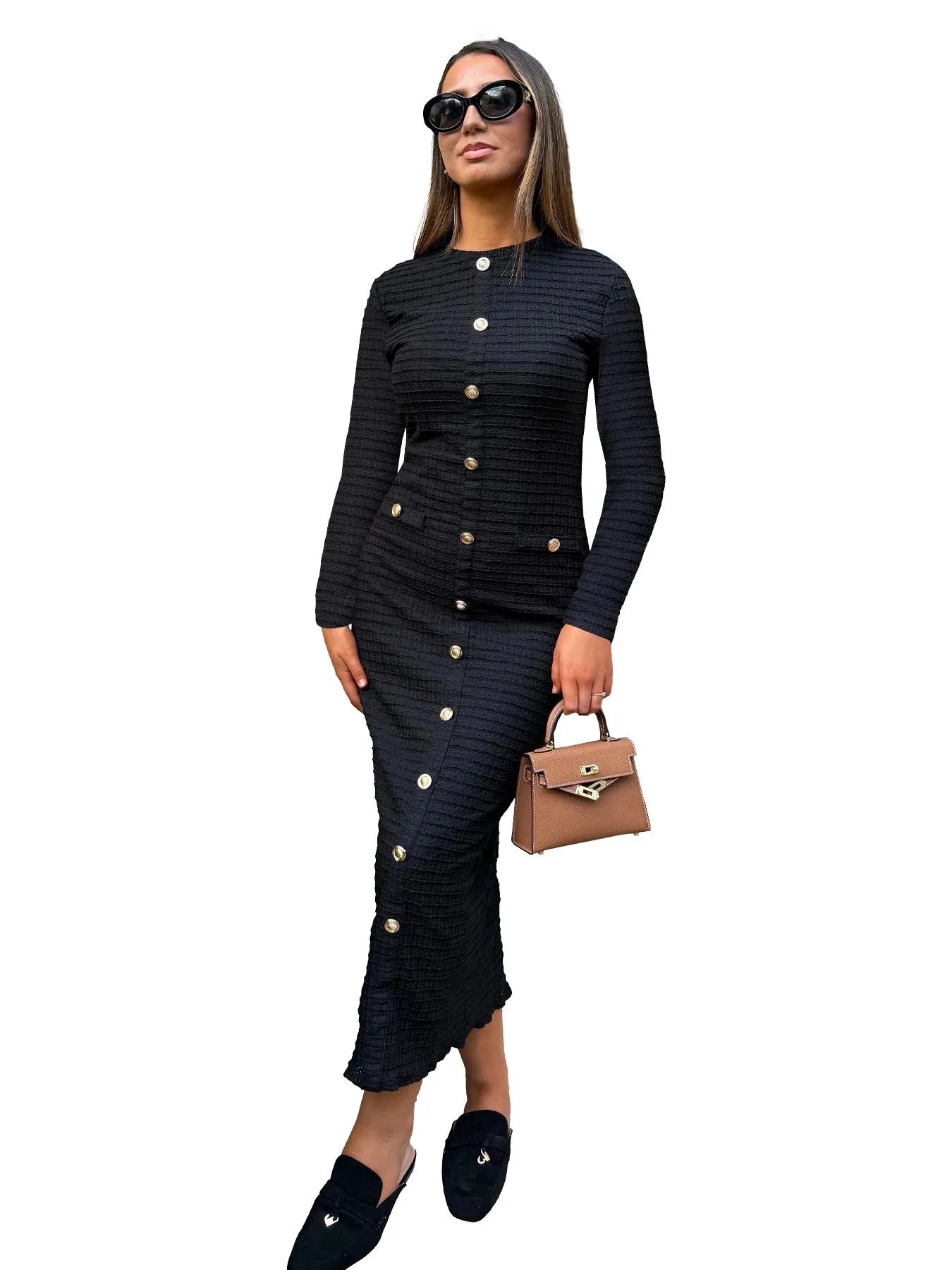 Black French retro slim fit knitted long-sleeved dress with button detail on a mannequin.