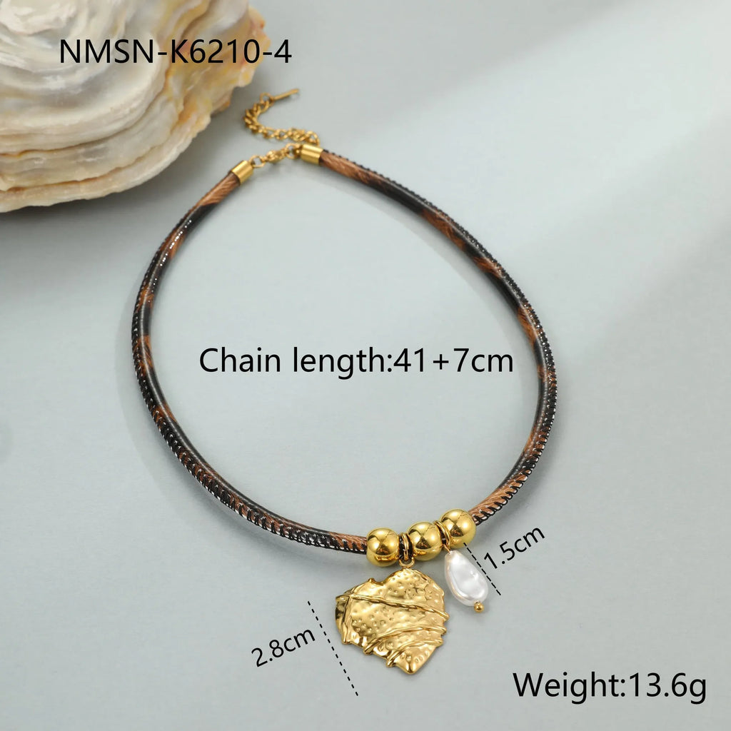 Leopard print geometric pendant on stainless steel necklace with gold-plated accents
