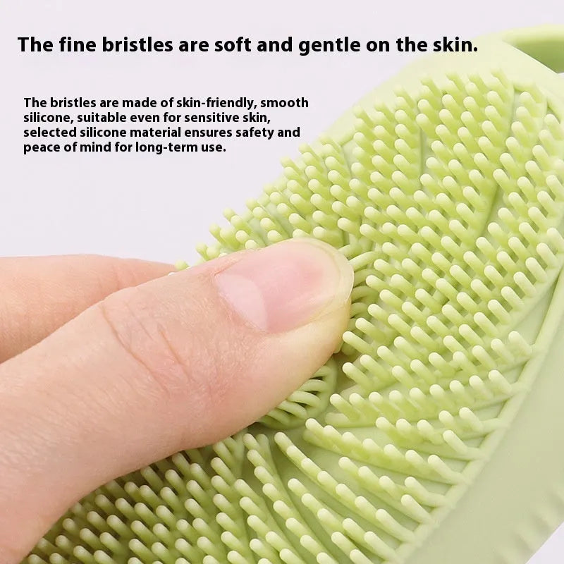 Silicone bath brush storage bottle in a choice of colours including pink and sea blue on a bathroom counter.