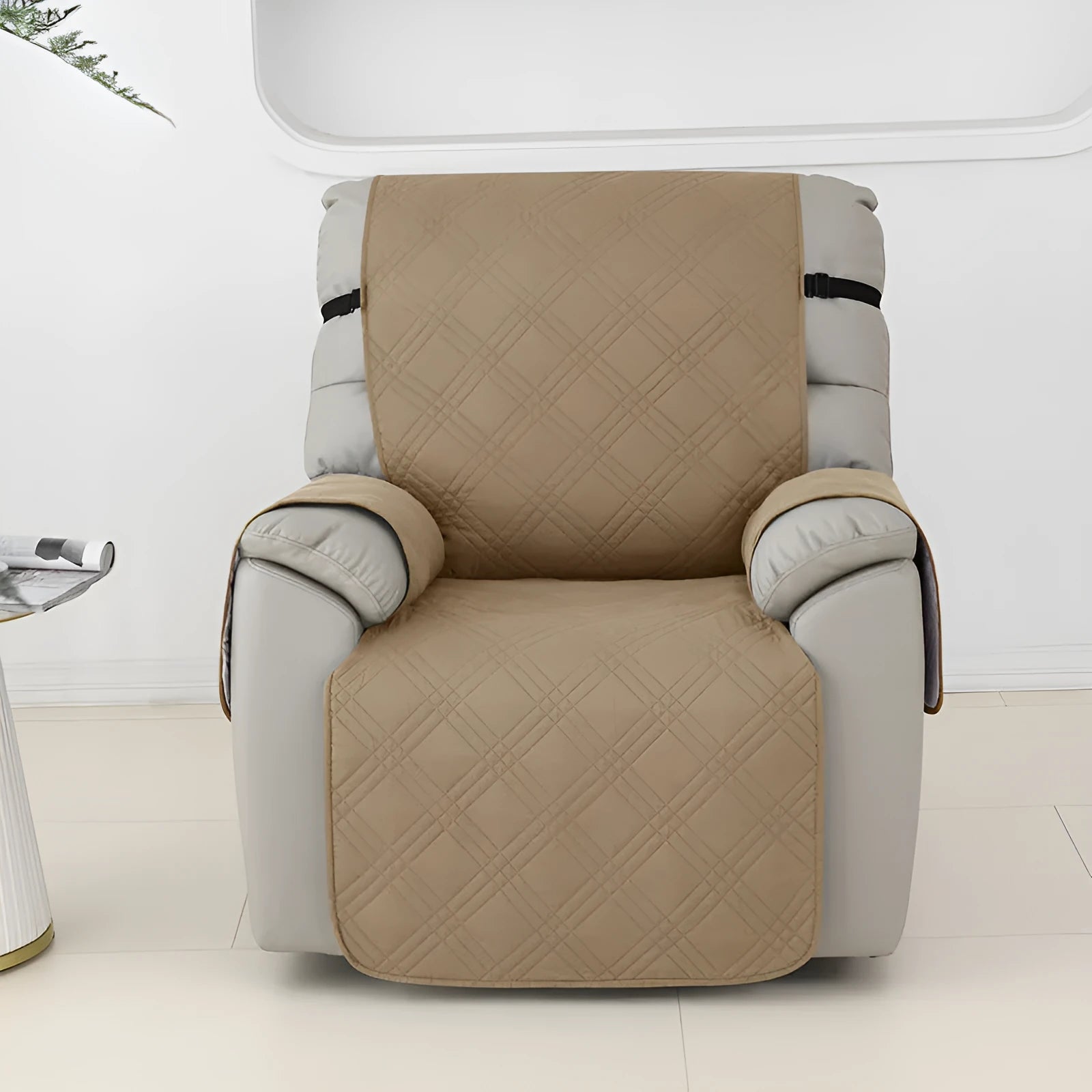 Quilted burgundy waterproof sofa cover stretched over a small single-seat massage chair cushion.