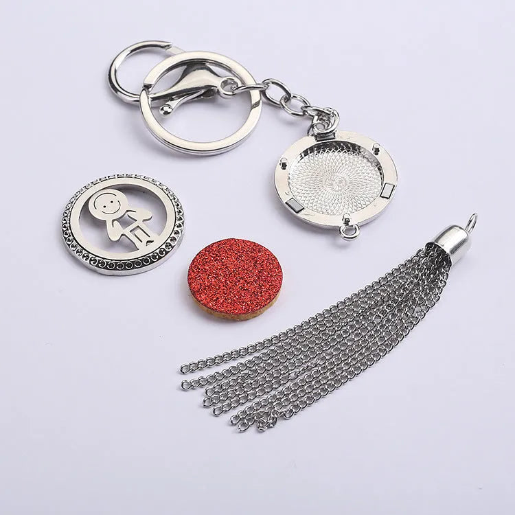 Alloy tassel car pendant with long chain hanging, showing decorative box detail.