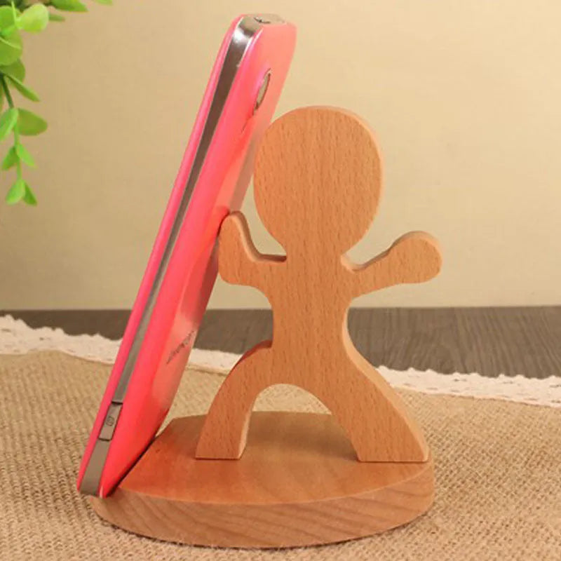 Solid beech wood mobile phone stand with a decorative resin animal ornament and a coin slot.