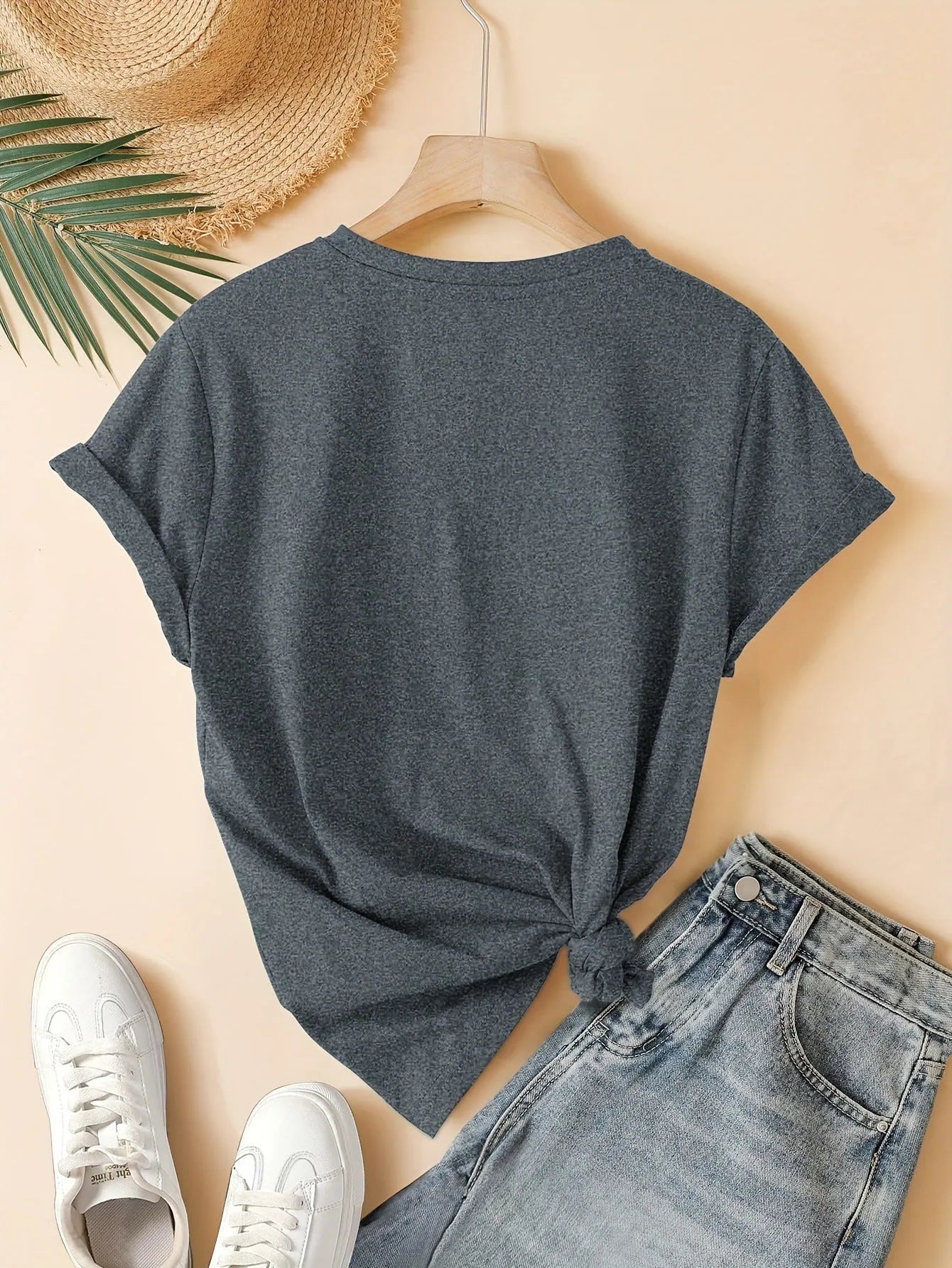 Women's printed cotton round neck t-shirt in blue on a hanger, showing art retro short sleeve design.