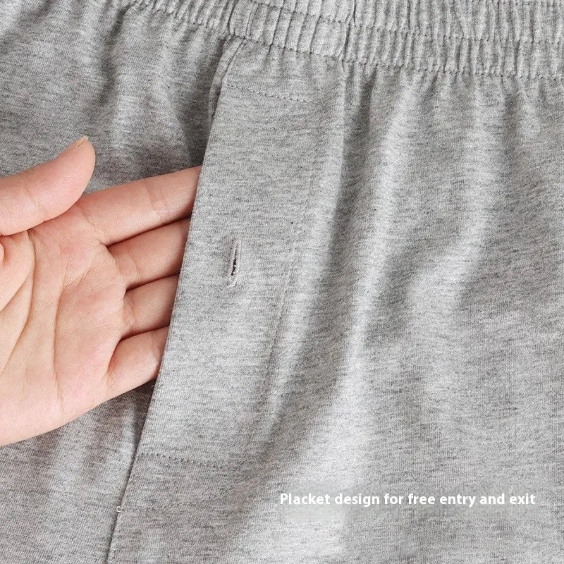 Men's loose-fit pure cotton boxer shorts in light grey, shown laid flat to display high-waist design.