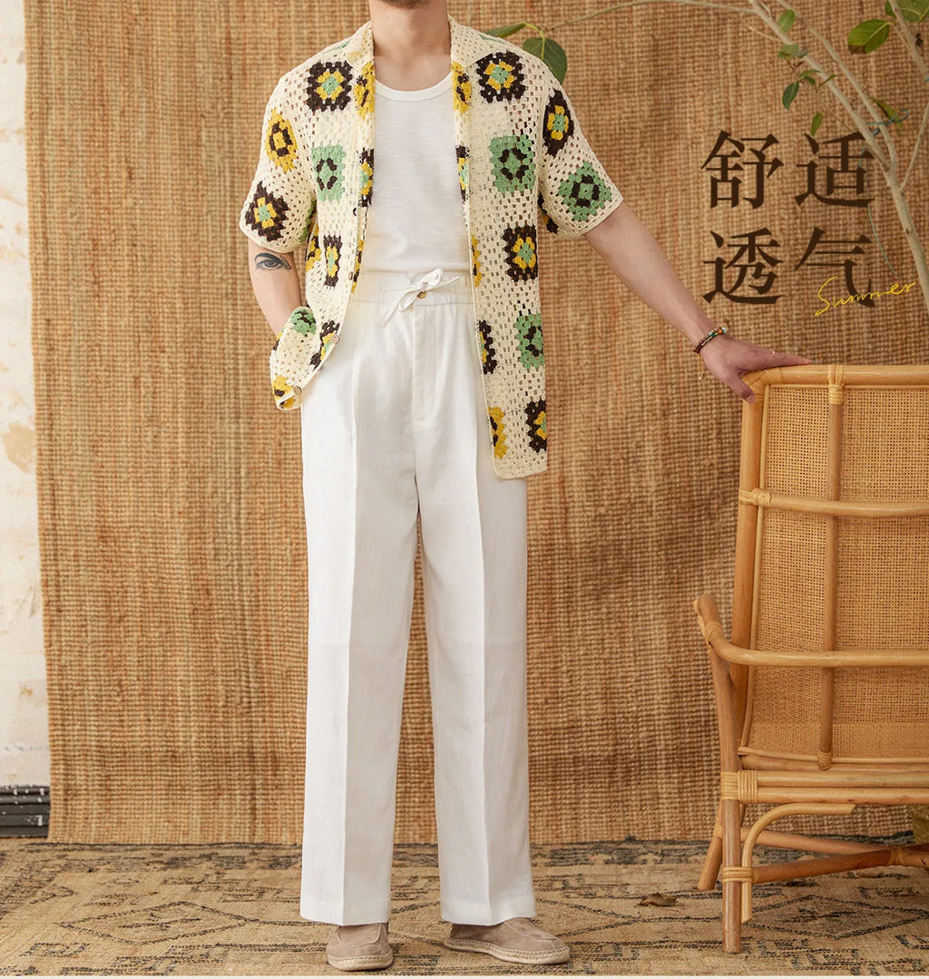 Linen straight-leg trousers in greige with an elasticated high waistband on a neutral background.