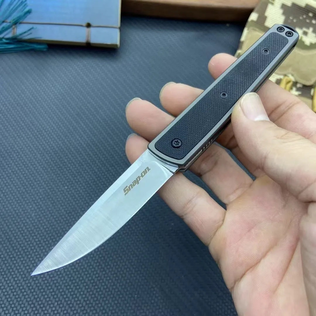 Folding fruit knife with stainless steel blade in black, brown, or red colour options