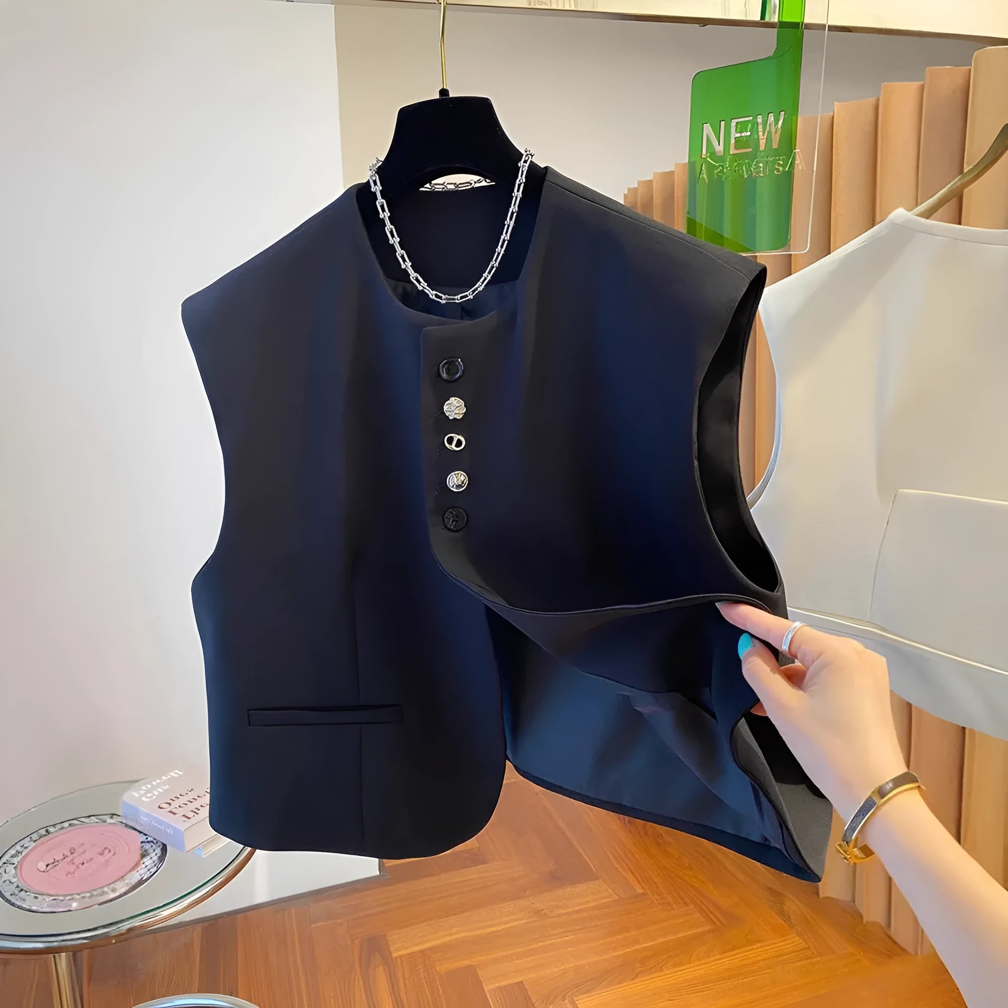 Loose-fitting solid colour polyester waistcoat with pockets available in beige and black sizes S to XXXL
