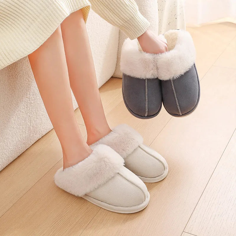 Women's plush winter slippers in pink with a round toe, flat heel, and anti-slip PVC sole.