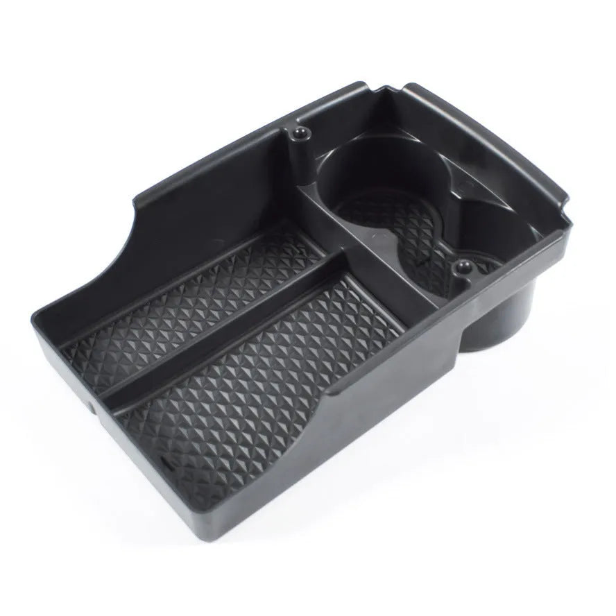 Tesla central armrest storage box retrofit accessory shown in vehicle console