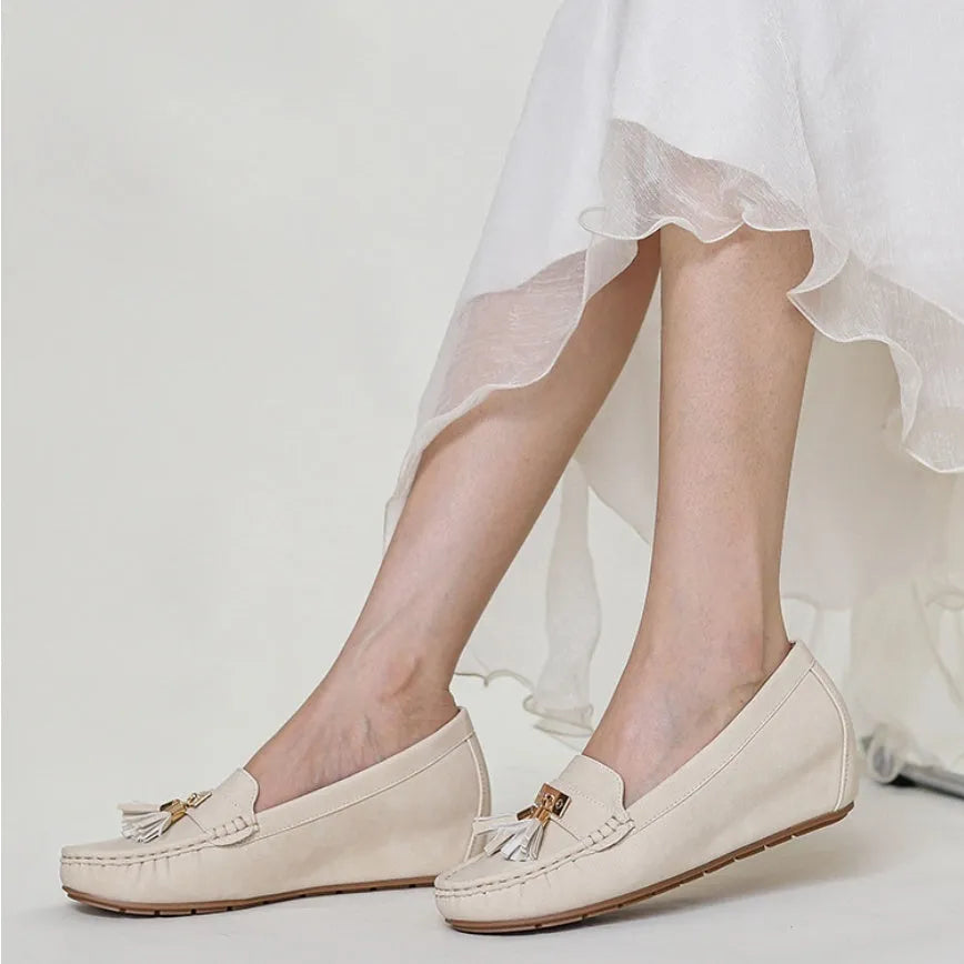 Nude casual work shoes with a heel height increasing insole, shown in available colours.