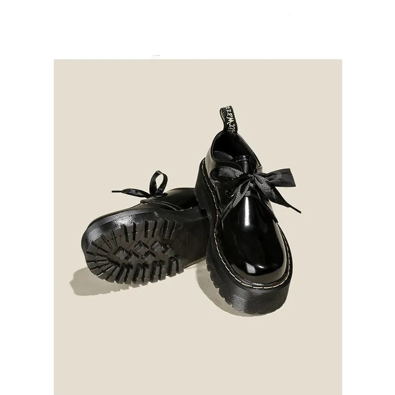 Women's thick-soled leather shoes with lace-up closure and decorative ribbon detailing