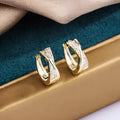 Geometric copper earrings with zircon treatment in 14K yellow colour
